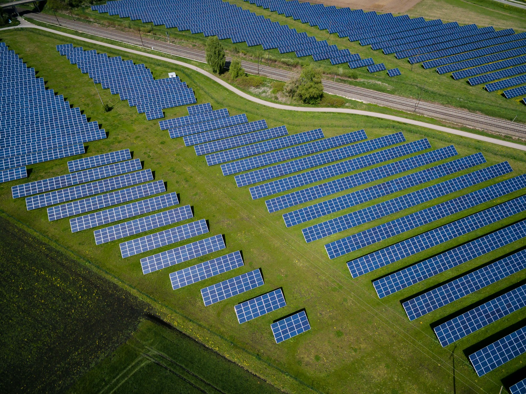 Photovoltaic arrays across an open landscape, illustrating solar EPC work.